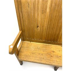 20th century solid light oak high back settle, moulded panelled back, curved seat ends with arms