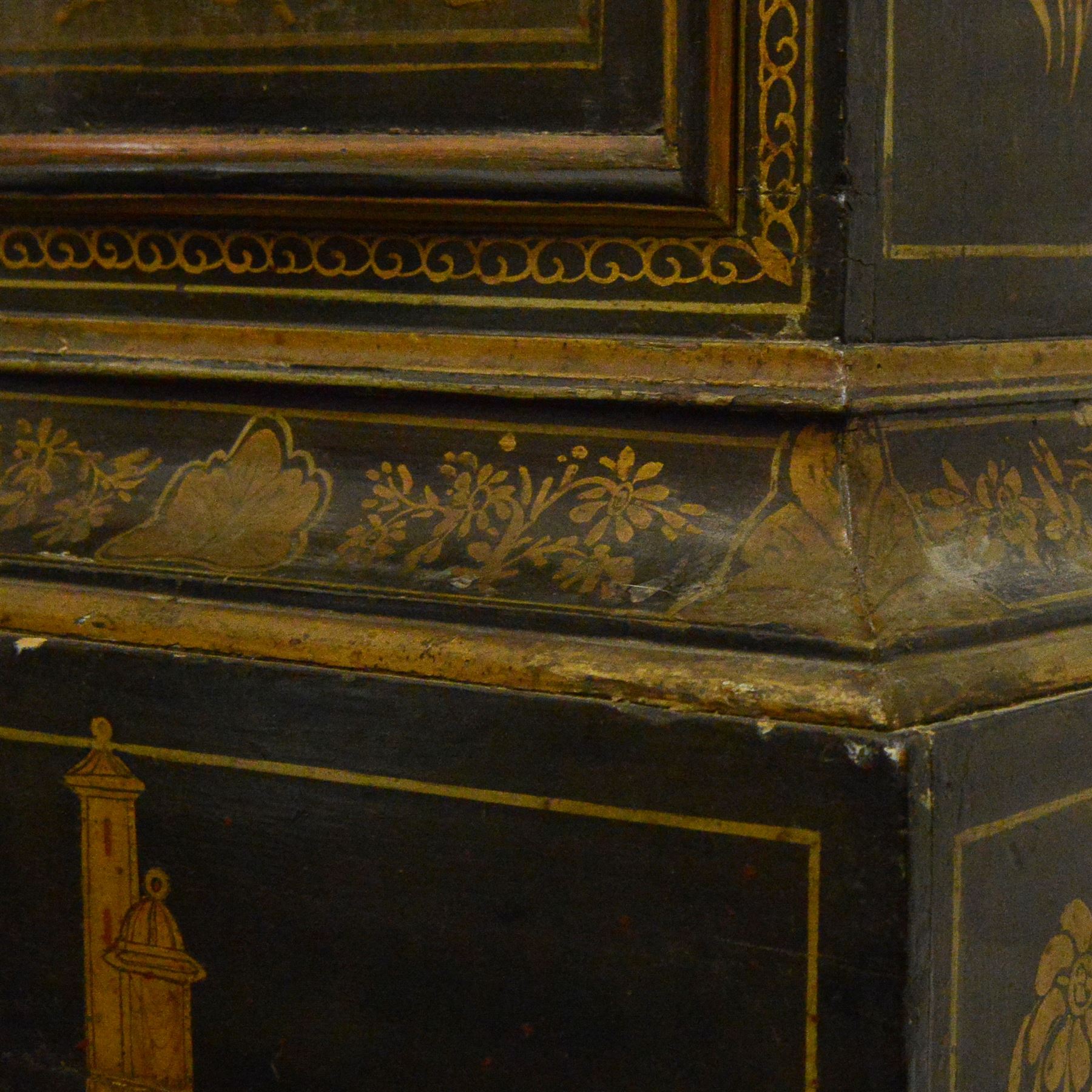 William Hayler of Chatham (Kent) - Fine George III black japanned chinoiserie decorated longcase clock c1760,  hood with a break arch top, glazed side panels and three matching wooden finials, conforming hood door beneath with attached pilasters, long trunk with a  break arch door and moulded surround, on a square double stepped plinth with a flat base, case and hood profusely decorated with scenes of gilt pagodas, temples, birds, people and panels of floral decoration, brass dial with cast brass spandrels and a silvered boss to the arch, silvered chapter with Roman numerals, minute track and five minute Arabic's, matted dial centre with seconds dial, date aperture, matching steel hands and silvered cartouche with makers name, dial pinned directly to a five-pillar rack striking movement with a recoil anchor escapement. With  pendulum, weights  and key.
William Hayler is recorded as working in High Street, Chatham, from 1750-1810, possibly two makers (father & son) working in succession.

