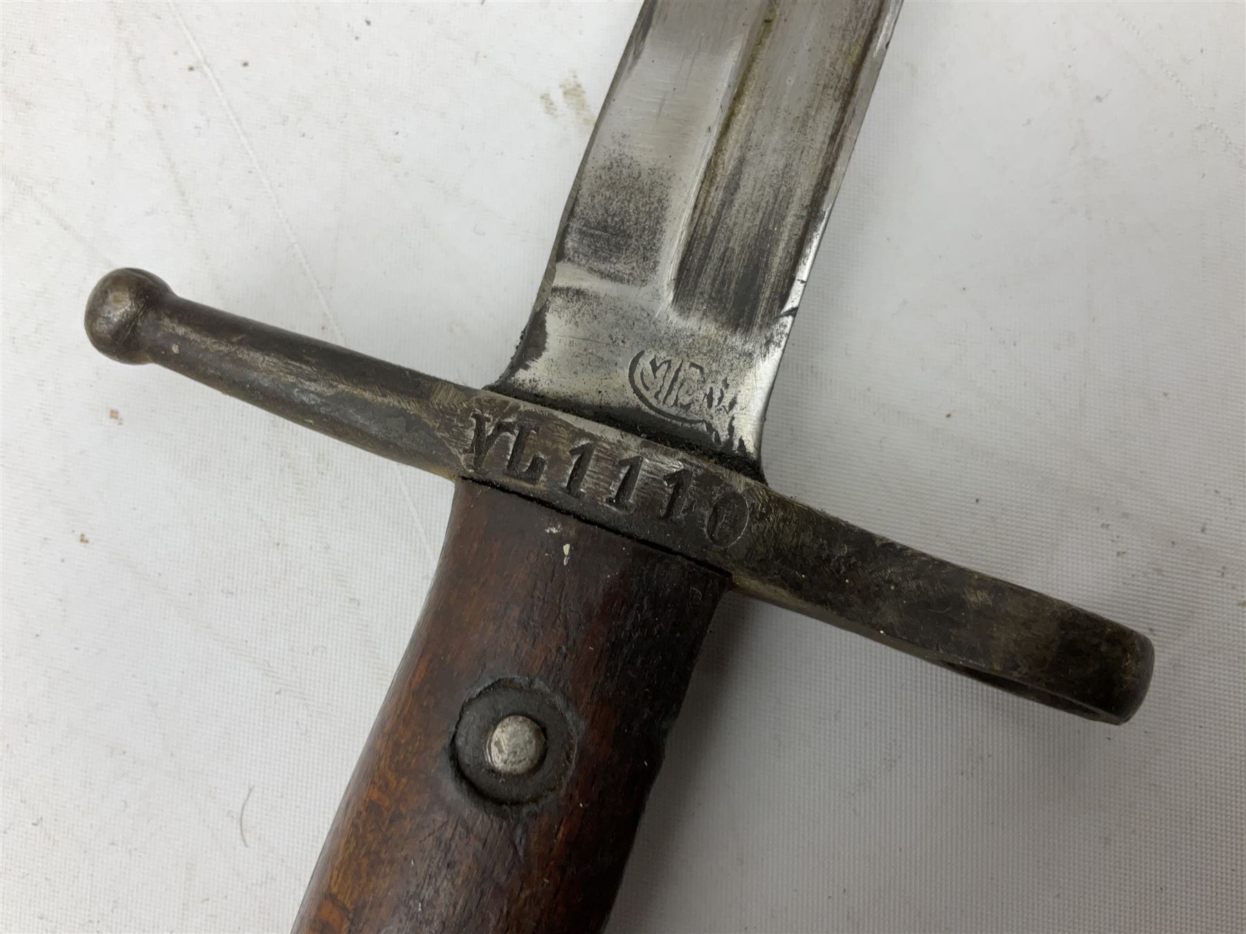 Italian Model 1891 Carcano knife bayonet with 30cm fullered steel blade, the cross-piece stamped VL1110; in steel scabbard with webbing frog L43cm overall; and another Italian fighting knife/bayonet in brass bound leather scabbard (2)