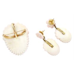 19th century gold conch shell pendant / brooch and matching earrings, each with carved bust shell of a cherub / child and flower head decoration, the earrings suspending a further flower head stud