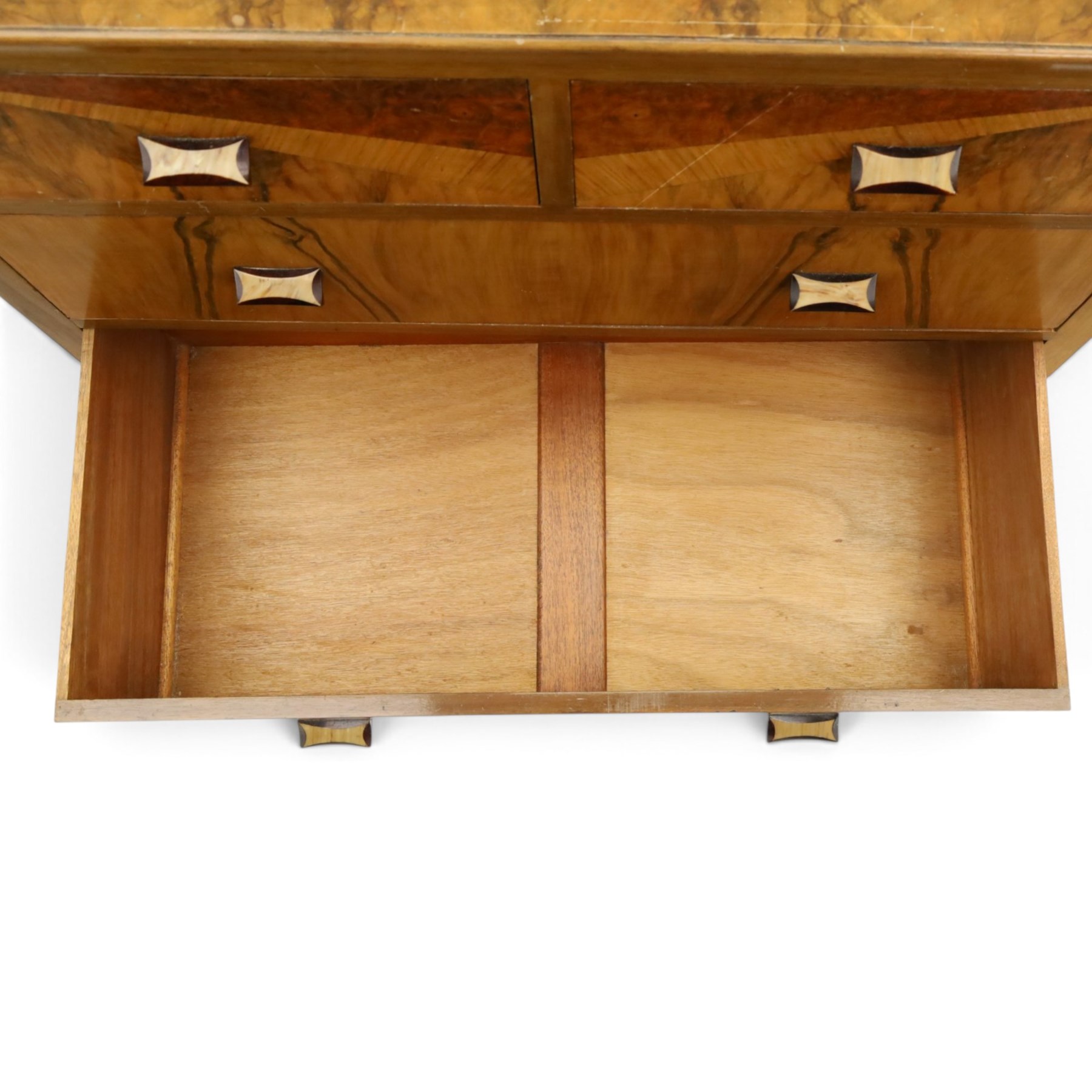 Art Deco figured and burr walnut chest, raised back over rectangular top, fitted with two short over two long drawers with decorative veneer and handles, on shaped bracket feet