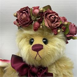 The Cotswold Bear Company - two teddy bears from ‘The Flower Collection’ comprising ‘Mayflower’ no.99/100, blonde mohair with dark pink flower crown and bow, H33cm; ‘Phoenix’ no. 99/100, blonde mohair with white and red rose flower crown and bow, H28cm; both with original labels and purchase receipt (2)