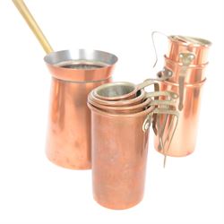 Copper and brass measures, including set of three copper jugs, set of four graduating brass pans and two sets of copper and brass cup measures