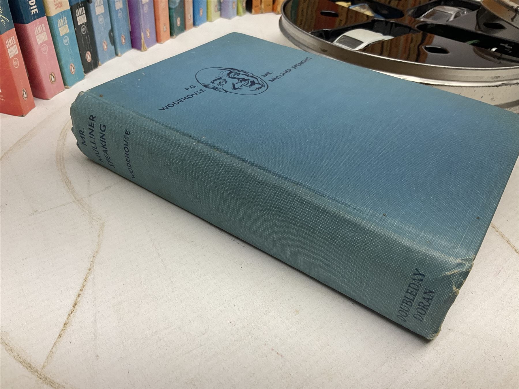 Wodehouse P.G.: Mr. Mulliner Speaking. First American edition 1930; eighteen P.G. Wodehouse paperback books; fourteen James Bond paperback books and Corgi tin of four James Bond die-cast model cars