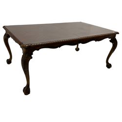 Chippendale Revival - hardwood extending dining table, rectangular gadroon carved top, on acanthus carved cabriole supports with ball and claw feet, with two additional leaves; together with a set of eight (6+2) dining chairs, shaped cresting rail over pierced and carved splat, upholstered drop-in seat, on acanthus carved cabriole supports with ball and claw feet