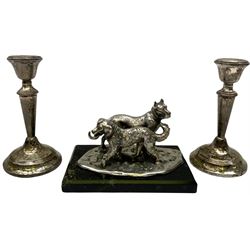 Pair of small silver filled candlesticks, hallmarked London 1921, maker's mark JE, H13cm, together with a silver plated figure group of two dogs, upon naturalistically modelled base stamped ARGENTOROX, upon rectangular plinths, H8.5cm L14cm