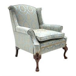 Late 20th century Queen Anne style walnut wingback armchair, on shell carved cabriole feet, sprung seat with seat cushion, upholstered in blue Damask fabric