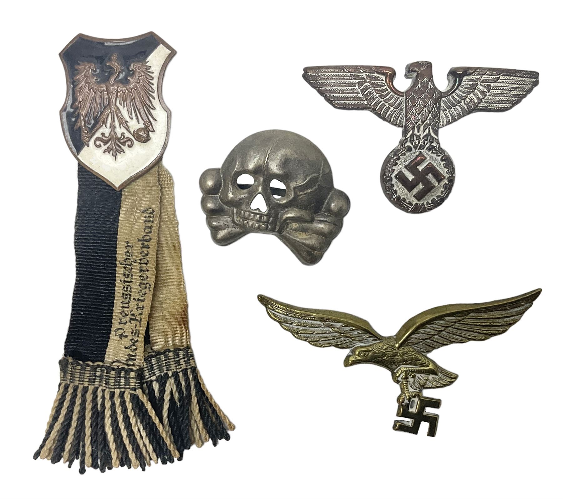 Imperial German Prussian Army Service Veterens Association badge; 'SS' type first pattern cap skull; Luftwaffe metal eagle uniform insignia; and another metal eagle cap insignia (possibly police?) (4)