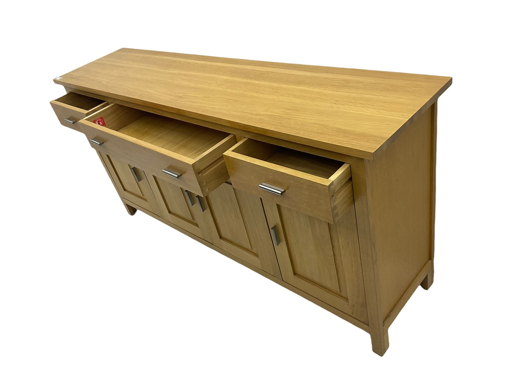 G-Plan - light oak sideboard, fitted with three drawers and four panelled cupboards