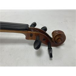 Copy of a full size Stradivarius violin, with an ebonised fingerboard, tailpiece and tuning pegs Length 60cm
