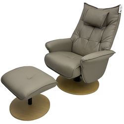 Contemporary swivel and reclining armchair upholstered in greyish brown leather with matching footstool 