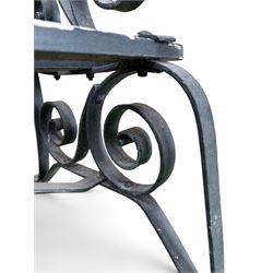 Coalbrookdale - rare pair of wrought iron and slatted wood garden benches, the twin wrought iron strapwork bench-ends formed of four scrolls over splayed feet, number 77 in the Coalbrookdale Castings Catalogue (see illustration)