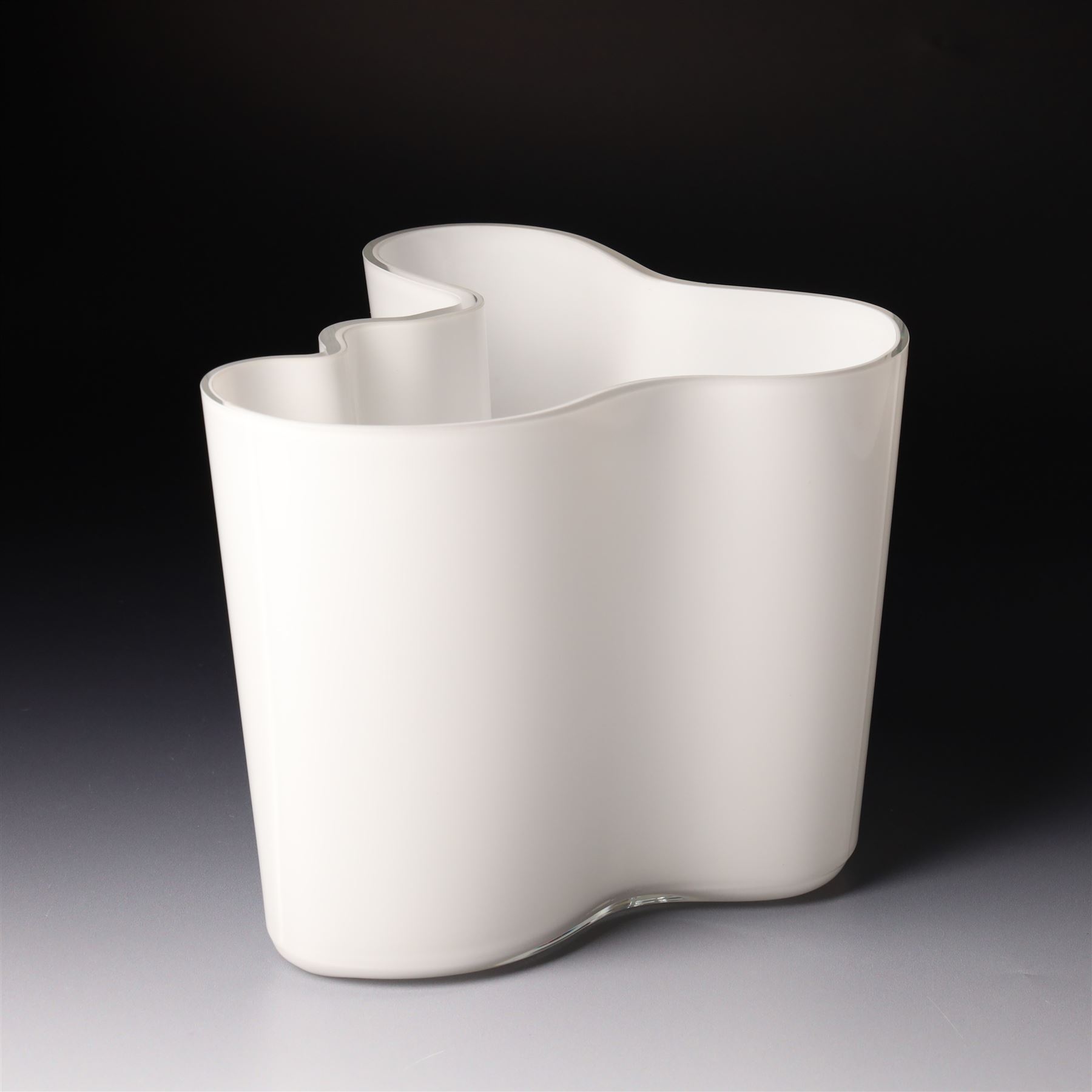 Alvar Aalto (Finnish 1898-1976) for Iittala: Set of three white glass vases, marked Alvar Aalto to base, largest H16cm (3)
