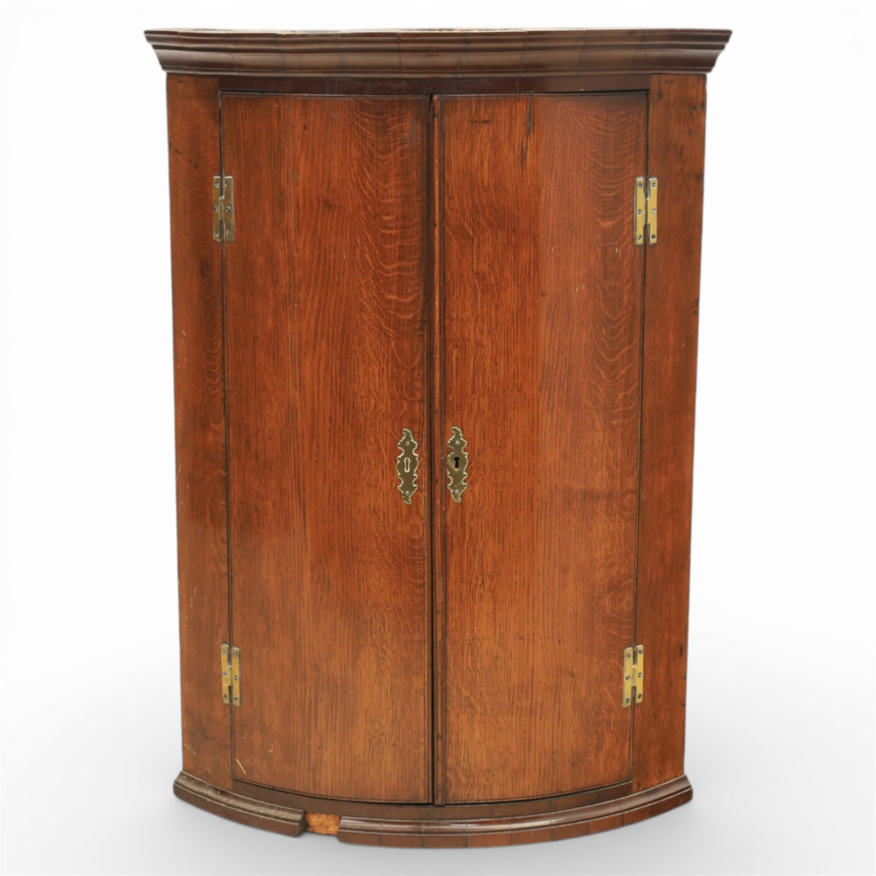 George III oak and mahogany wall hanging cylinder corner cupboard, moulded cavetto cornice over double cupboard enclosing three shelves