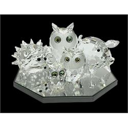 Swarovski crystal owl group of three, hedgehog and pig on display mirror