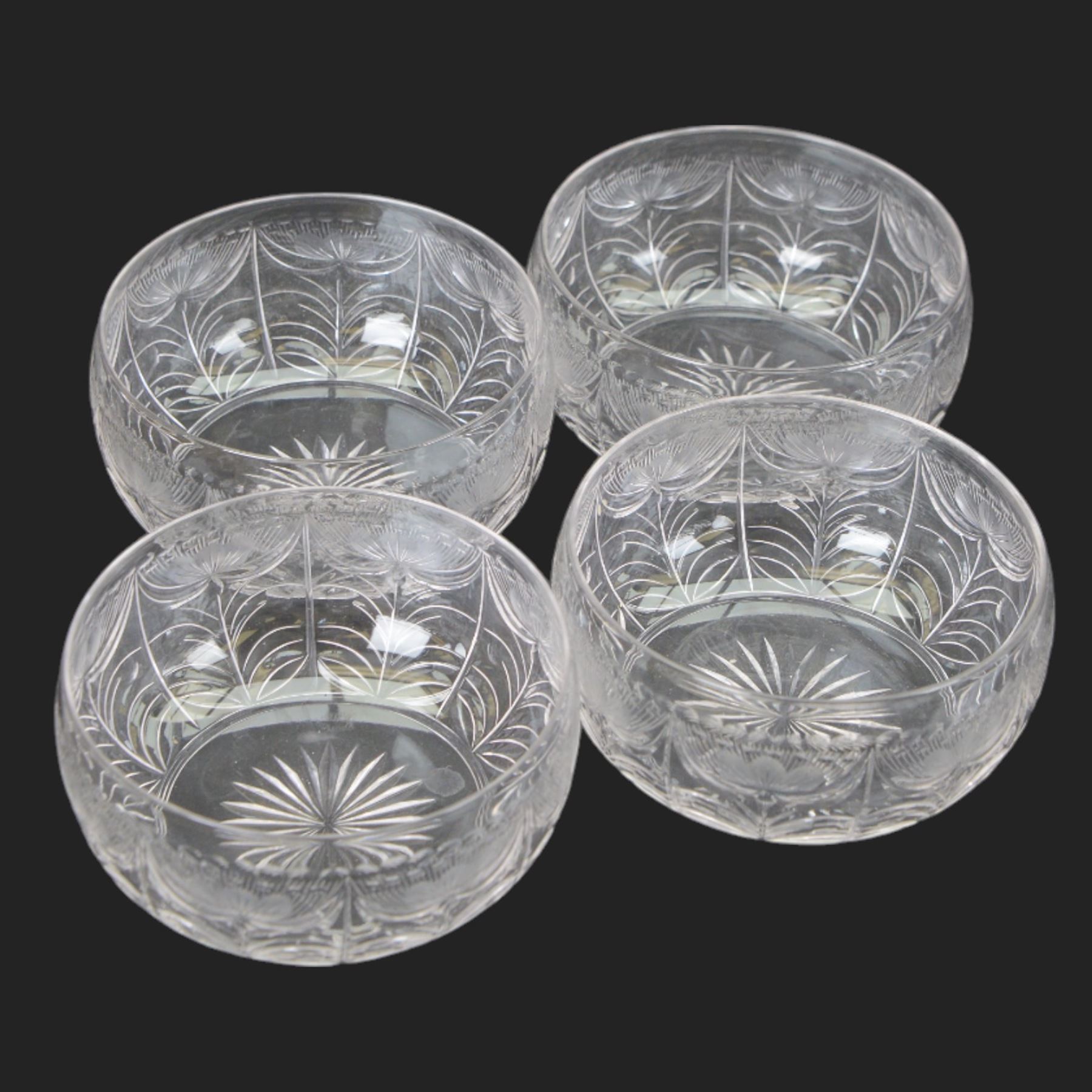 Six cut glass goblets, each with etched and cut floral decoration, together with eight similar bowls, a pair of Waterford Crystal glasses, eight champagne coupes etched with Greek Key border and four etched with floral border