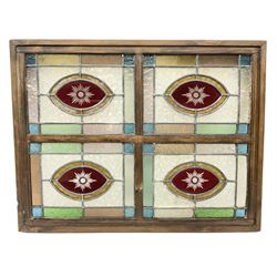 Leaded stained glass panel in frame, consisting of four panels in blue, green, peach, orange and red, W52cm H40cm