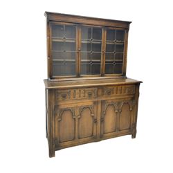 Mid-20th century oak dresser, raised back enclosed by three lead glazed doors, fitted with two drawers and two cupboards
