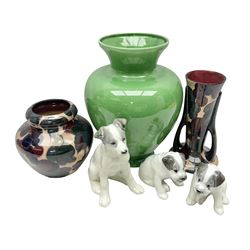 Three Lomonsov USSR figures modelled as dogs, together with two tuscan faience vases and green vase