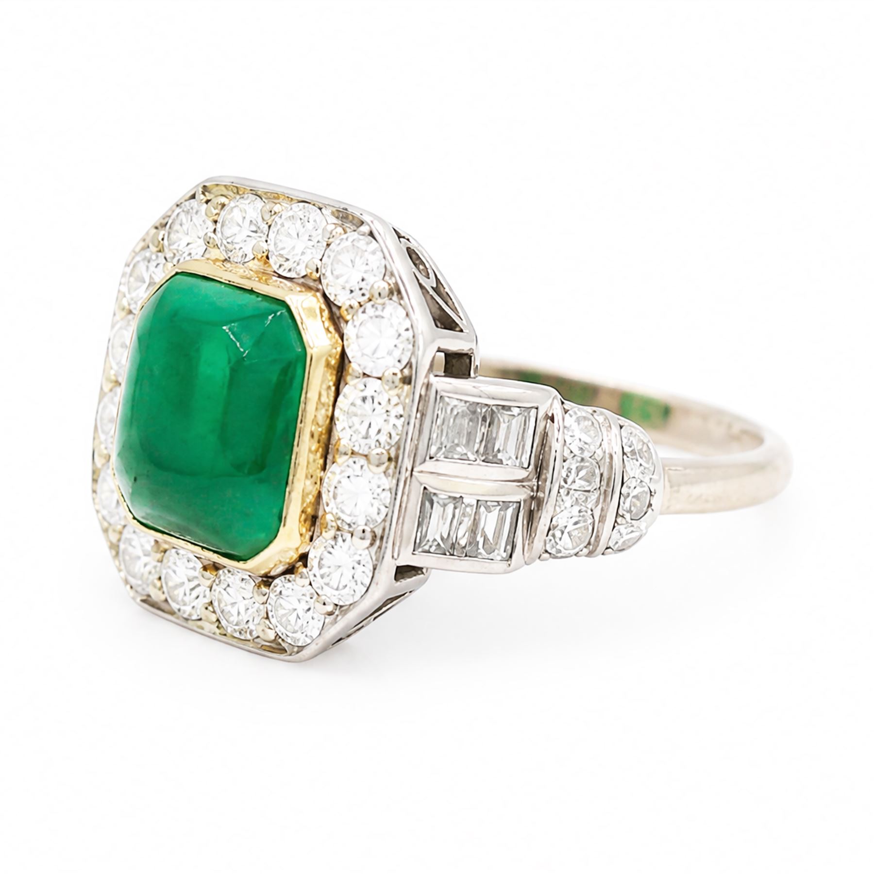 18ct white gold and platinum emerald and diamond cluster ring, single octagonal cabochon cut emerald, surrounded by sixteen milgrain set round cut diamonds, the shoulders set with baguette and single cut diamonds, stamped 18ct, total diamond weight approx 1.55 carat