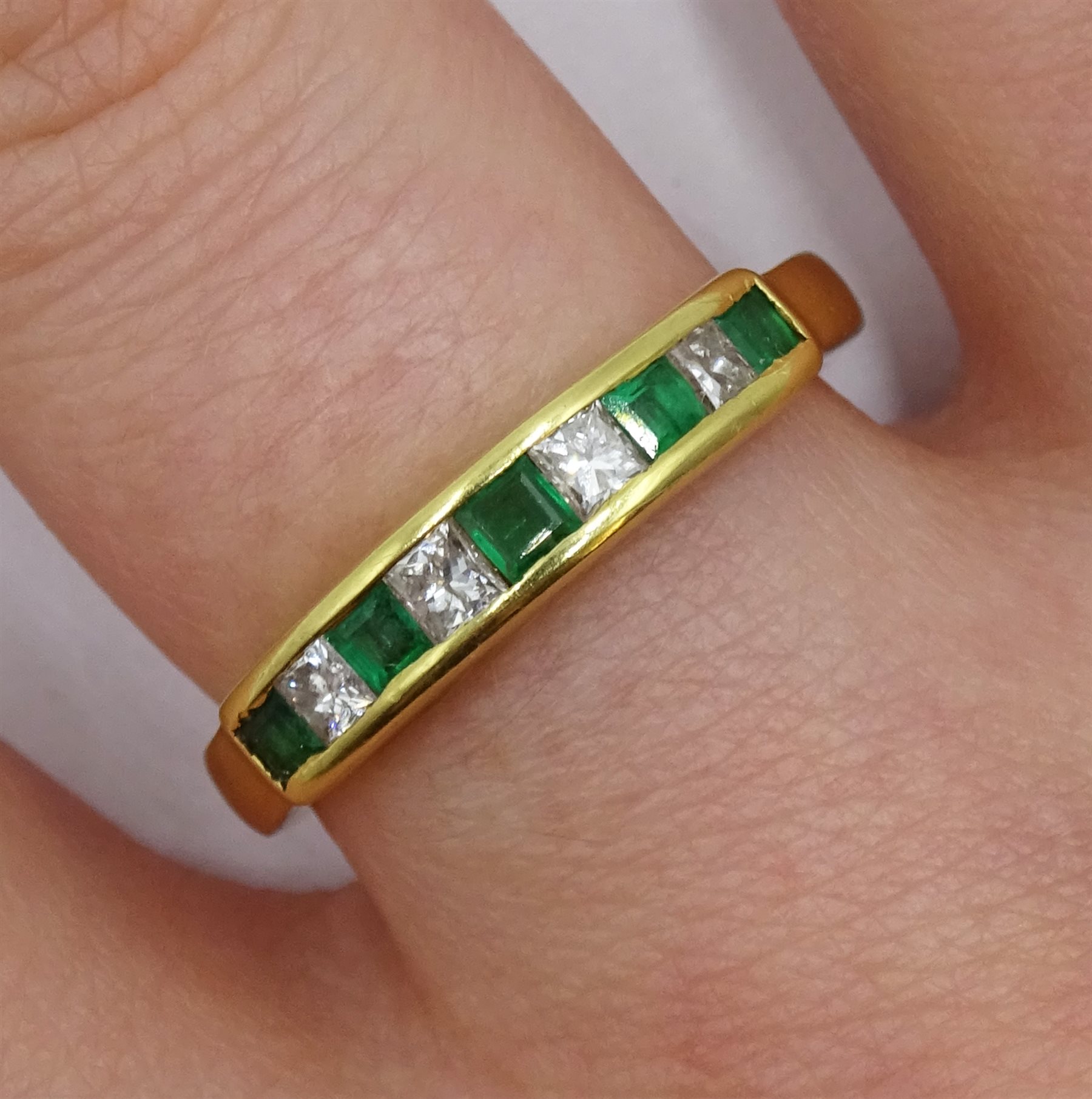 18ct gold princess cut emerald and diamond half eternity ring, London 1989