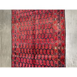 Persian Karajeh rug, the blue ground field decorated with Boteh type motifs, three band border each decorated with stylised flower heads  