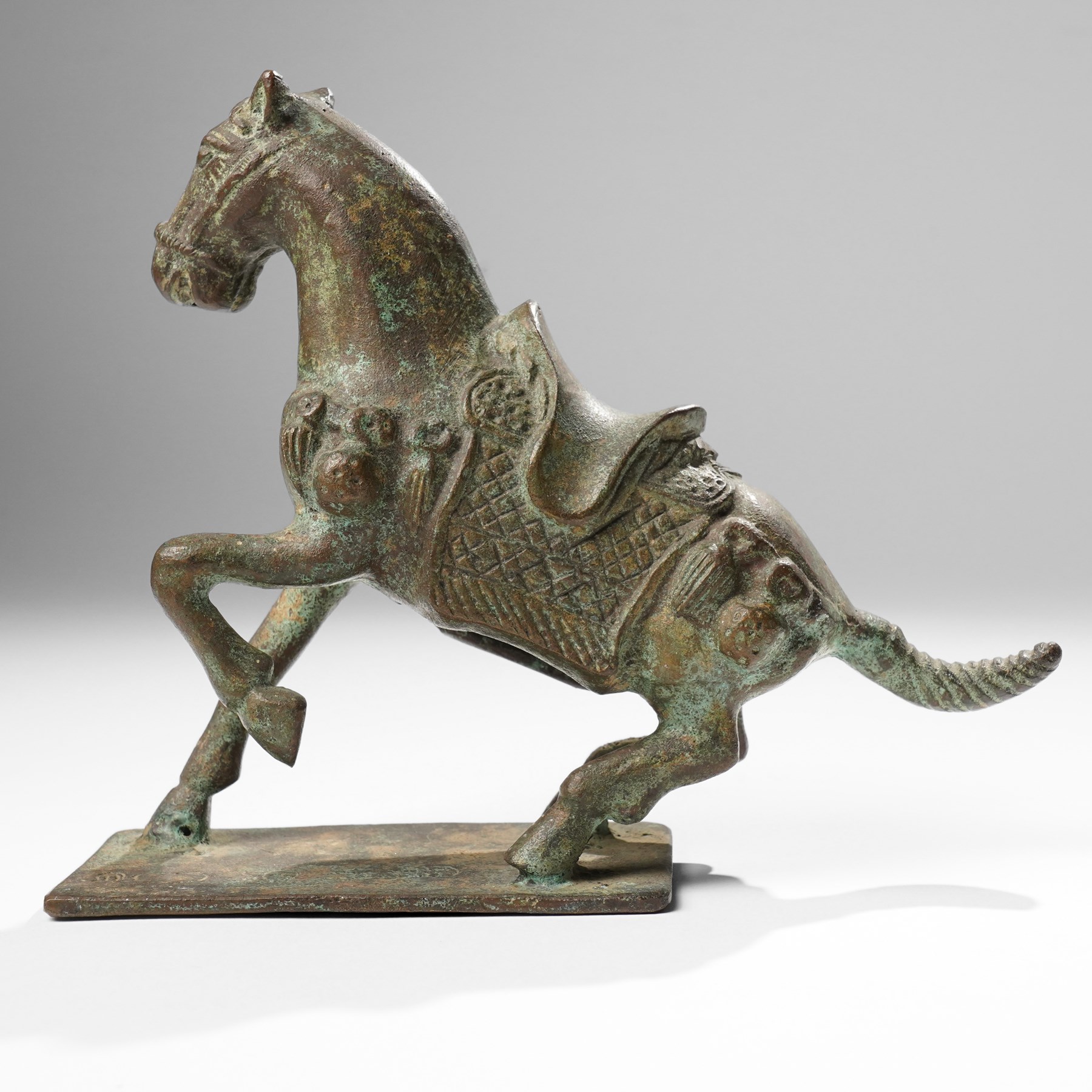 Chinese archaistic bronze wine vessel, Shang dynasty style but 20th century, W25cm; together with a Tang dynasty style model of a rearing horse, H17.5cm (2)