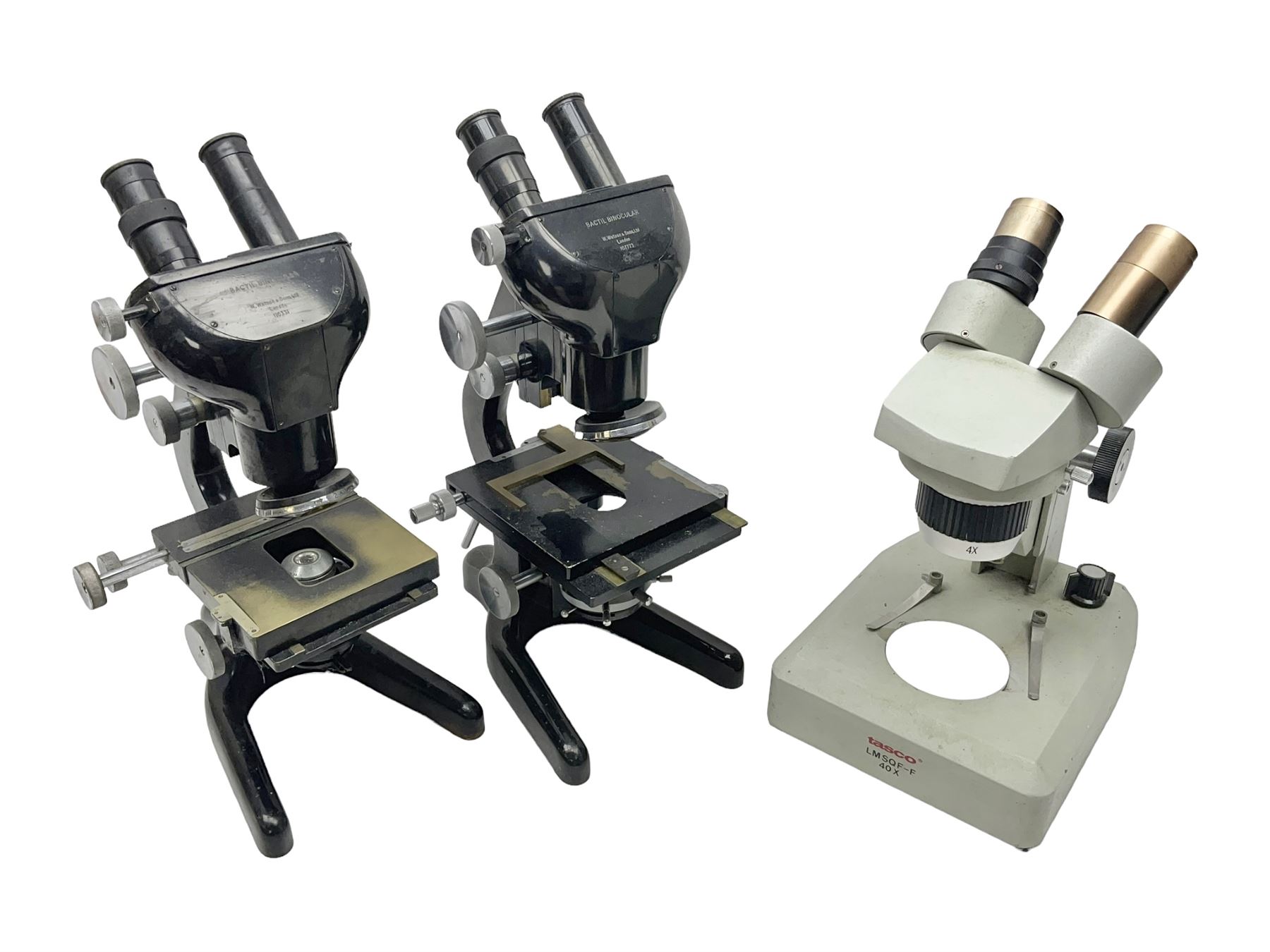 Three Binocular microscopes, comprising two W. Watson & Sons Bactil no 110331 and 107773 and Tasco LMSQF-F