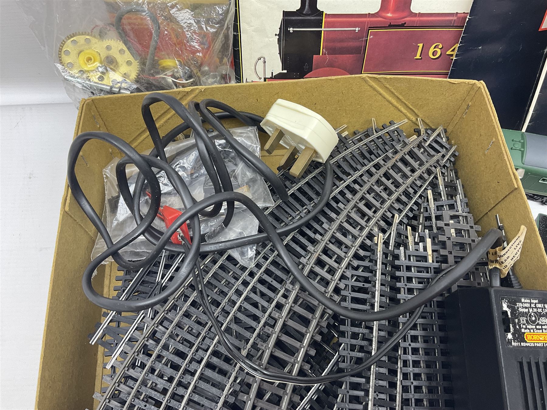 Hornby '00' gauge - Class 35 Hymek Diesel Hydraulic B-B locomotive No.D7063; Class 101 Holden Tank 0-4-0 locomotive No.101; nine wagons/coaches; track and controller; and 1978 catalogue; together with small quantity of loose Meccano with two booklets; all unboxed