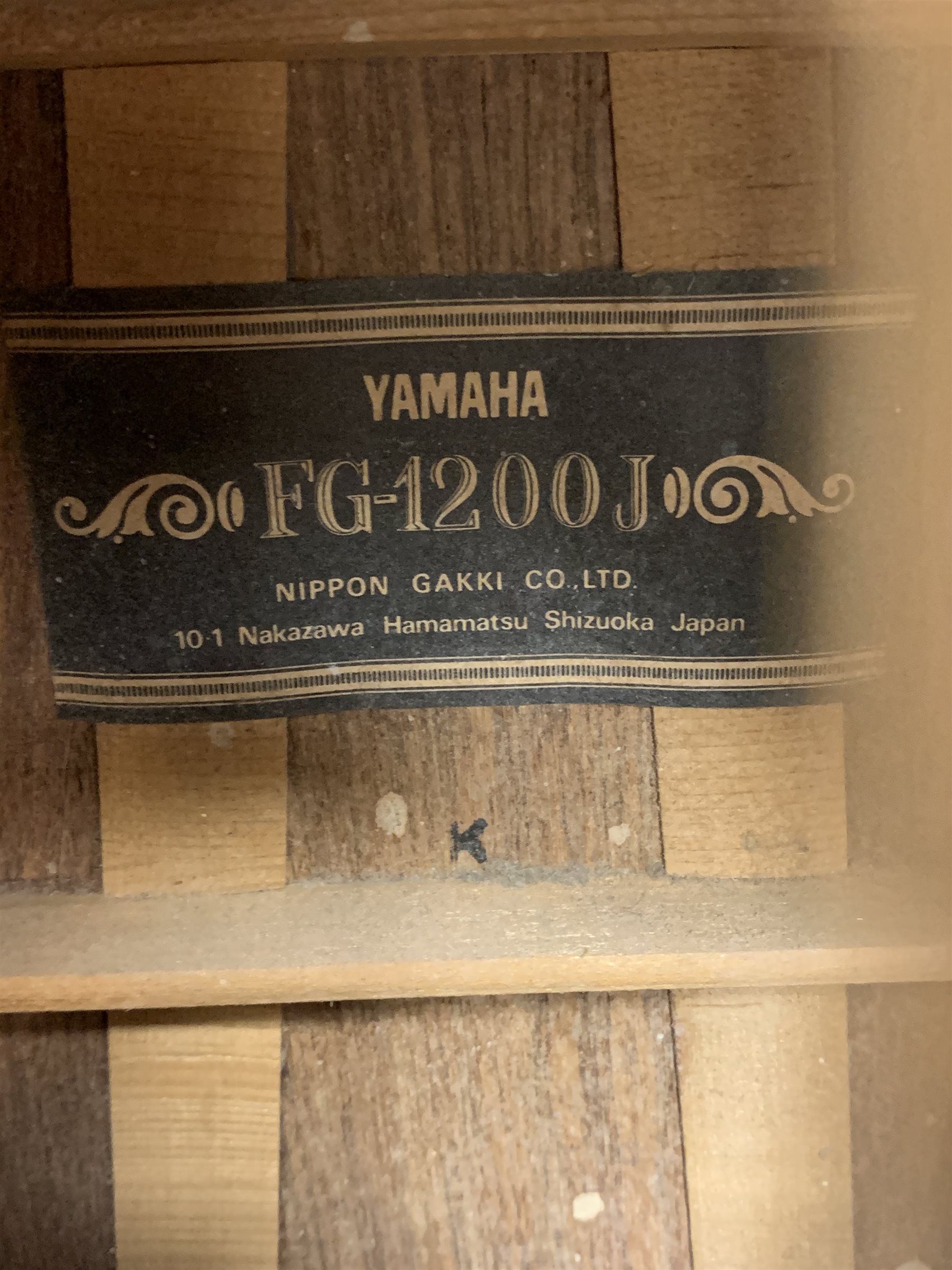 Rare Yamaha FG-1200J acoustic guitar, spruce top, solid Jacaranda back and sides, ebony fret board, mother-of-pearl bound top, three-piece back with abalone trim, in carrying case