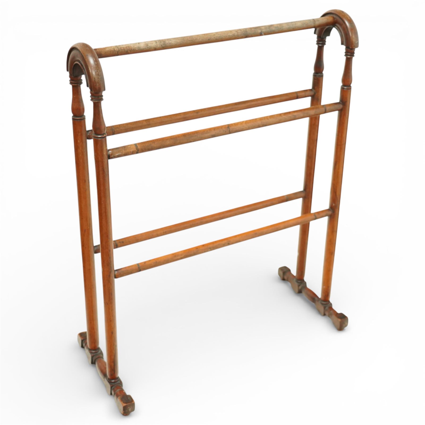 Two late 19th century mahogany toilet mirrors and a towel rail, one oval adjustable mirror on shaped uprights over a two-drawer base (H 73cm, W 48cm), the other with rectangular mirror plate on a hinged frame above a drawer base (H 44cm, W 37cm, D 17cm), together with a turned mahogany towel rail with arched top rail, double lower rails and splayed feet (H 81cm, W 65cm)