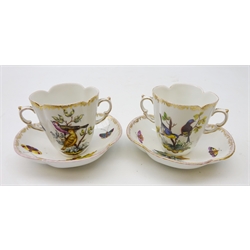  Pair late 19th century German Helena Wolfsohn quatrefoil chocolate cups and saucers, hand painted with birds perched on branches amongst insects within a floral gilt border (4)  