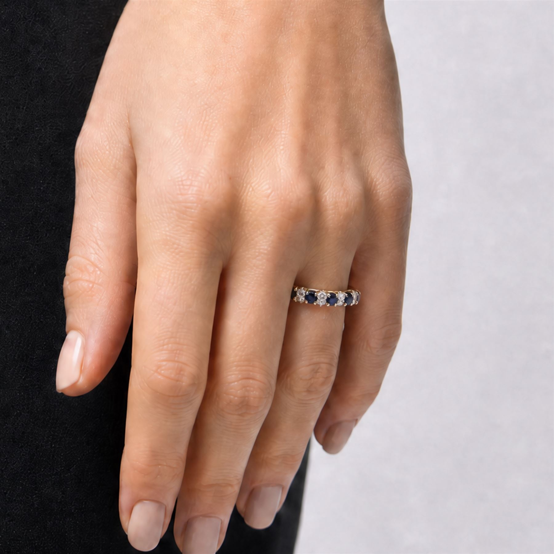 18ct gold sapphire and diamond ring, five round cut sapphires, spaced by two two round round brilliant cut diamonds, Birmingham 1983, total diamond weight approx 0.25 carat