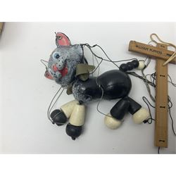 Pelham Puppet - three puppets comprising a painted wooden duck with felt mouth and wings with metal joints H12cm, in original box and instructions; and two further examples Type A cat with a hollow body H12cm, and a boy H23cm (3) 