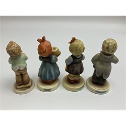 Thirty Hummel figures by Goebel, to include Saluting the Peacekeepers of Operation Joint Endeavor, on wooden plinth, Call to Glory, Celebrate with Song and Soldier Boy