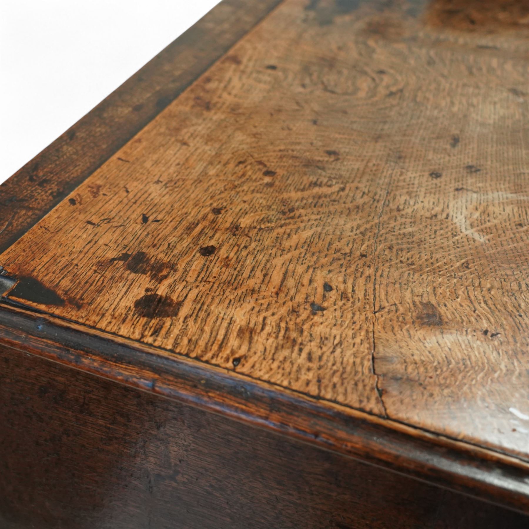 George III oak dresser base, fitted with three drawers with brass swan-neck handles, shaped apron and cabriole legs on pad feet 