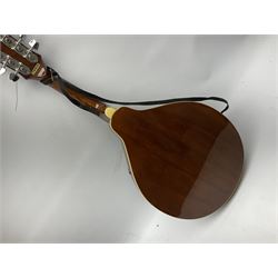 Palmer eight-string mandolin with mahogany back, simulated ivory and mother-of-pearl mounts L67cm; and Mahalo mahogany cased baritone scale ukulele, model no.U320B, L76cm; in hard carrying case (2)