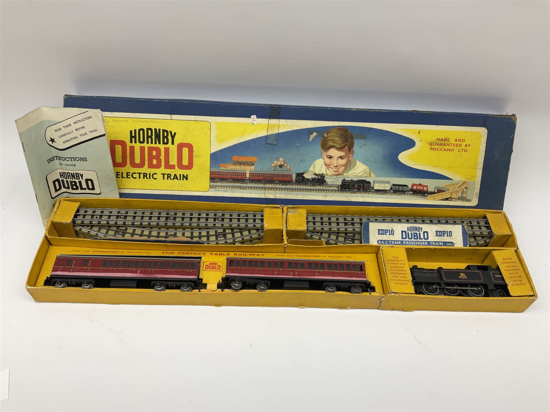 Hornby Dublo - three-rail EDP10 Passenger Train set with 0-6-2 tank locomotive No.69567, two coaches and track, in long box with instructions.