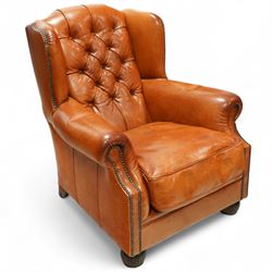 Tetrad - mid to late 20th century buffalo hide leather wing armchair, the button-tufted ba...