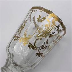 Three 18th century wine glasses comprising a plain stemmed glass with bell shaped bowl and conical folded foot H16cm, another plain stemmed glass with ogee bowl and folded foot and a Continental glass with gilt faceted bowl, decorated with male figure within a landscape, on a clear Silesian seven sided cut stem (3)