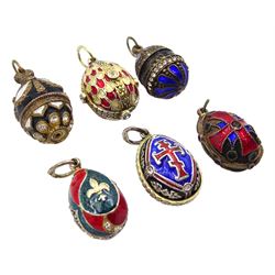 Six Russian silver and silver-gilt enamel and paste stone set egg pendants