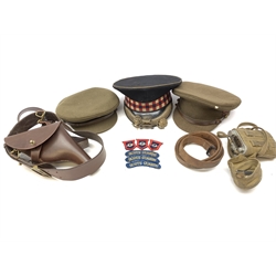 Scots Guards - two officer's peaked caps with chin strap and side buttons, one with badge, and blue dress peaked cap marked HEB for Harold Ellett-Brown; two Artist Rifles and one West Yorkshire cap badges and two Scots Guards shoulder flashes; officer's brown leather Sam Brown belt with shoulder brace strap and revolver holster; officer's Orilux trench torch etc
