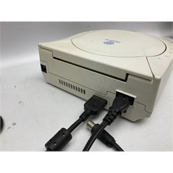 Dreamcast console, one controller, original instruction booklet with magazine and four games, ‘Aerowings’, ‘Buggy Heat’, ‘ Racing Simulation Monaco Grand Prix’ and ‘Who Wants to be a Millionaire’, all in original cases with instruction booklets 