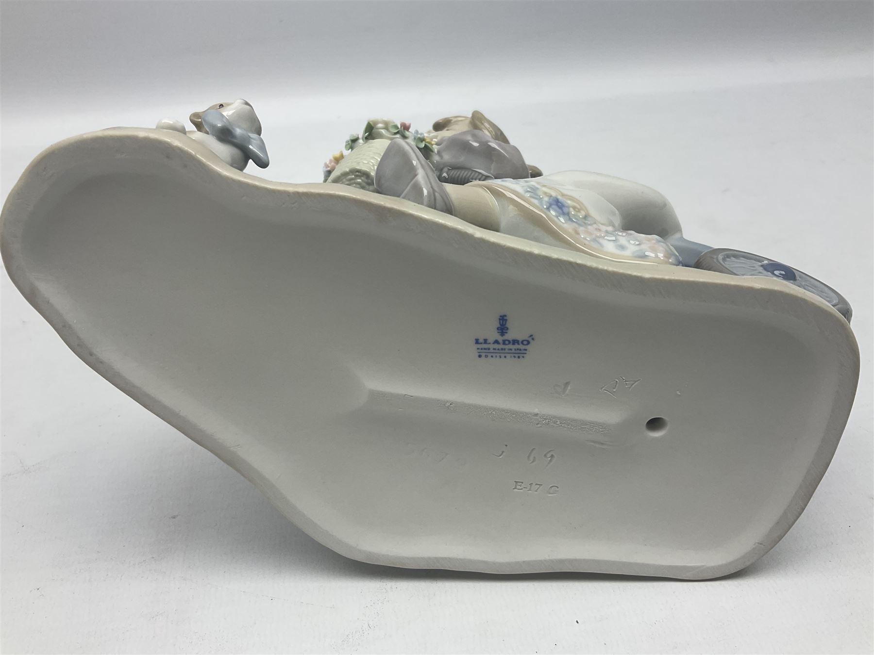 Lladro figure, In No Hurry, modelled as a girl on a tricycle, sculpted by Francisco Polope, with original box, no 5679, year issued 1990, year retired 1994, H15cm