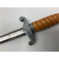 Late WW2 German Army Officers dress dagger, with unmarked 25cm double edged steel blade, orange celluloid grip, pommel and ferrule with oakleaves relief and cross guard with eagle; in original beaded scabbard with two hanging rings L39.5cm overall
