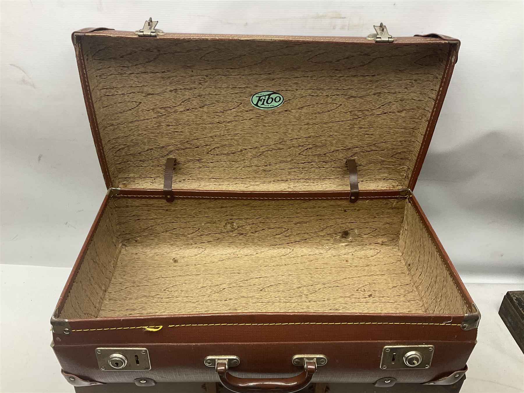 Three shooting sticks, together with four vintage leather brown suitcases of various sizes, largest suitcase H40cm L65cm 