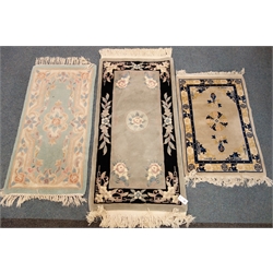  Chinese light blue ground rug, central floral medallion (140cm x 70cm) and two other similar rugs (3)  