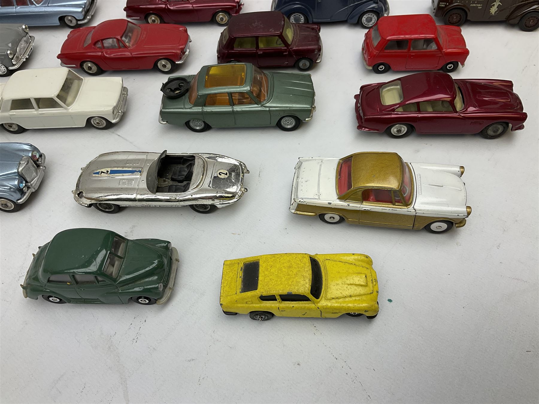 Corgi - thirty unboxed and playworn/repainted die-cast cars including Triumph Herald Coupe, BMC Mini-Cooper 'S', Porsche Carrera, two 'E' Type Jaguars, Rover 2000TC, three Morris Minors, two Aston Martin DB4, two Volvo P1800, MGA, Fiat 2100, Jaguar 2.4 Litre, Jaguar Mark X Saloon etc (30)