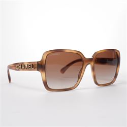 Chanel - pair of oversized sunglasses, with translucent tortoiseshell-effect brown acetate...