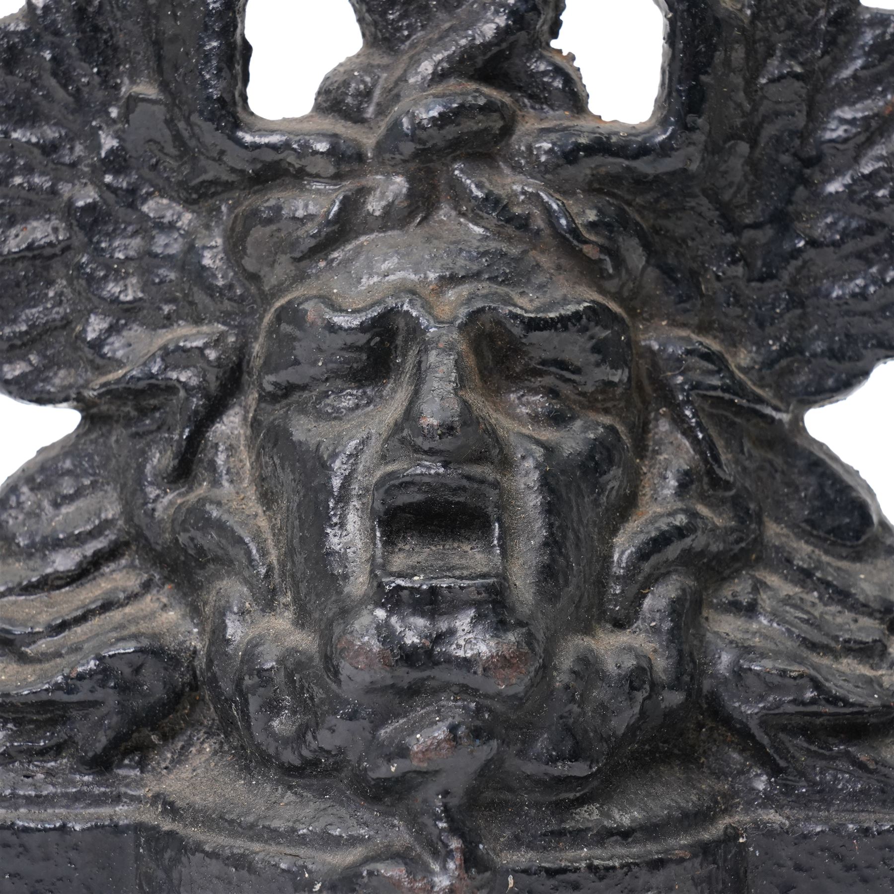 Victorian painted cast iron door porter, cast with a Medusa head and entwined serpents, H27cm
